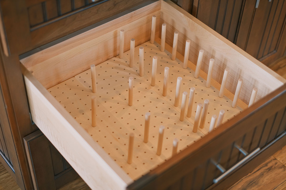 Pegboard drawer organizer with adjustable pegs